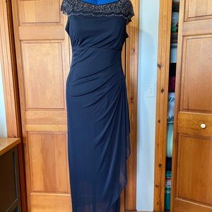 Long navy blue dress with beaded yoke.